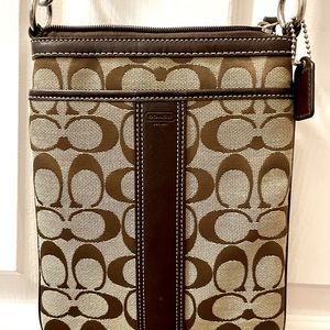 Leather-trimmed monogrammed fabric crossbody bag with leather accents